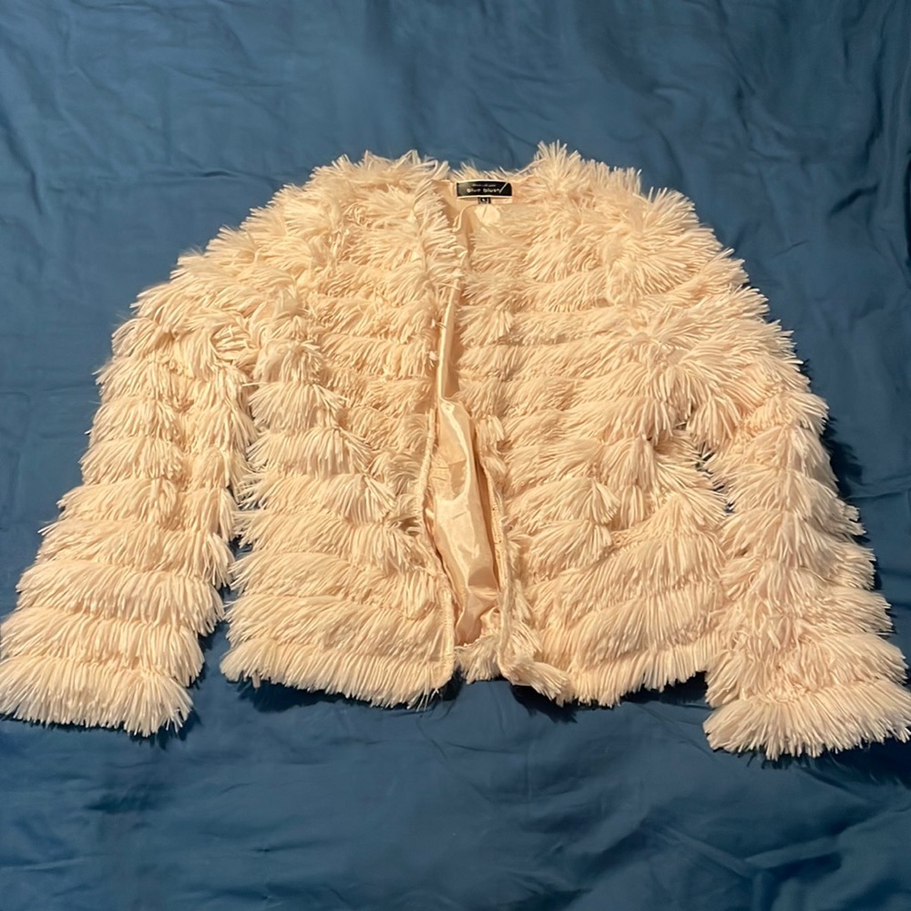 A fun spunky blush dress up jacket.